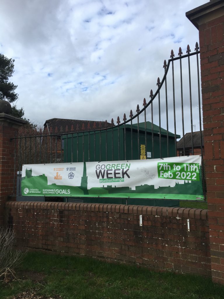 Banner for Go Green Week on the campus gate