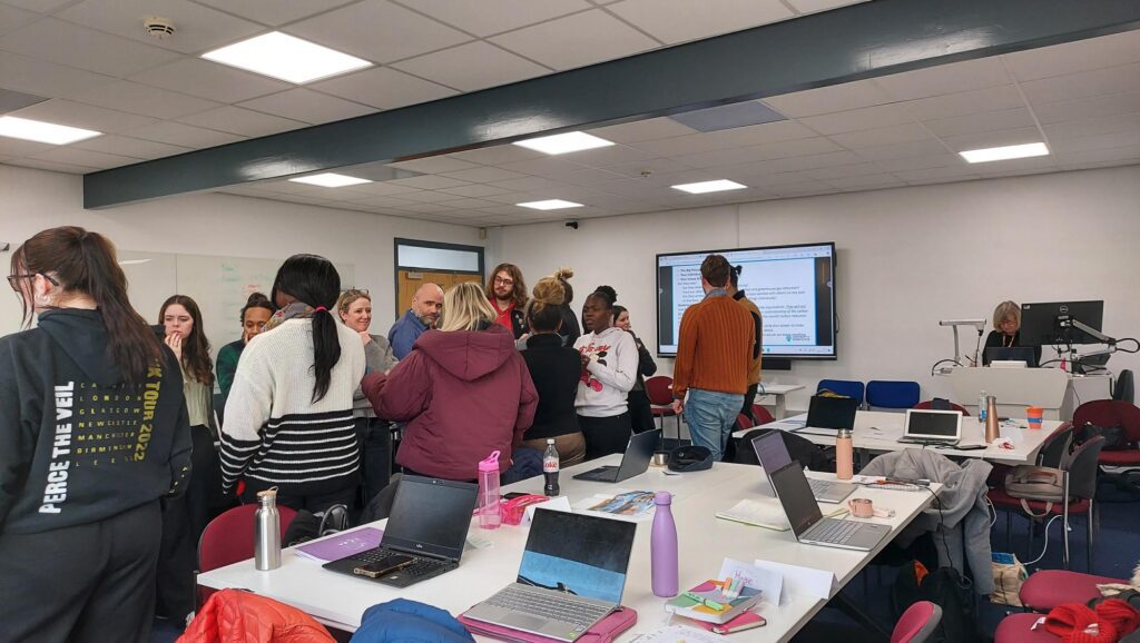 Photograph of a classroom of students recieving caron literacy training