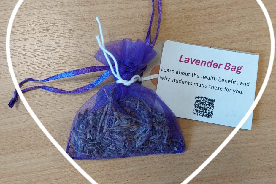Photograph of small lavender bag with card board label surrinded by a white heart