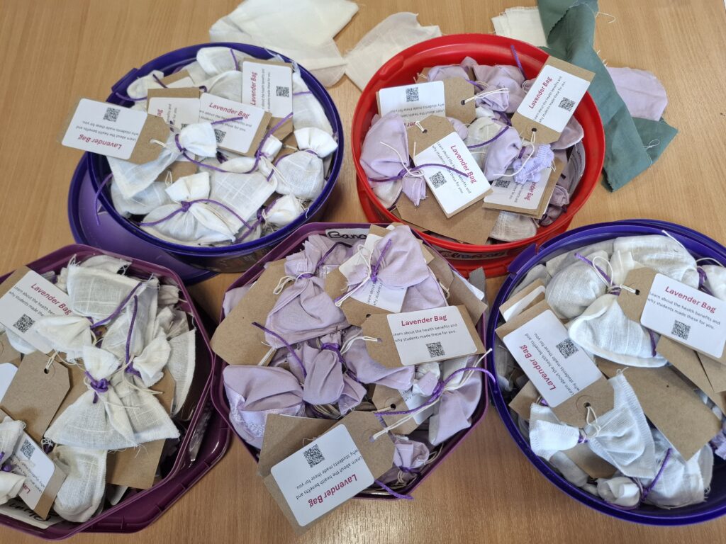 Repurposed natural fabrics, stored in sweet tubs.