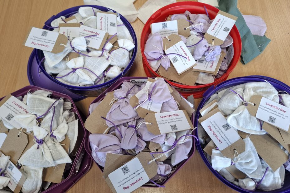 Repurposed natural fabrics, stored in sweet tubs.